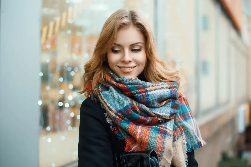Beautiful happy woman with a vintage scarf