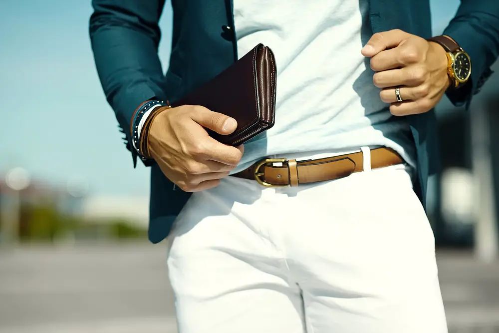Man in trousers with fashionable brown leather belt