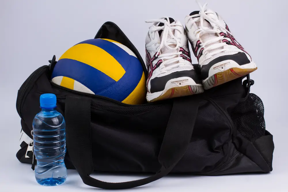 Sports bag with the volleyball ball and volleyball sneakers