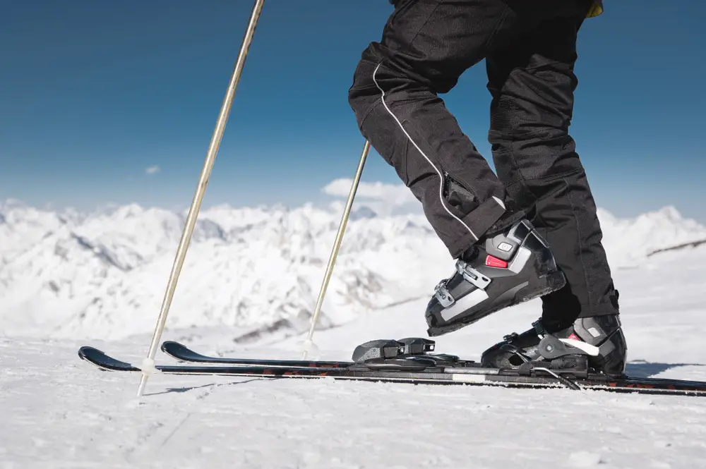 athlete's skier's foot in ski boots rises into the skis