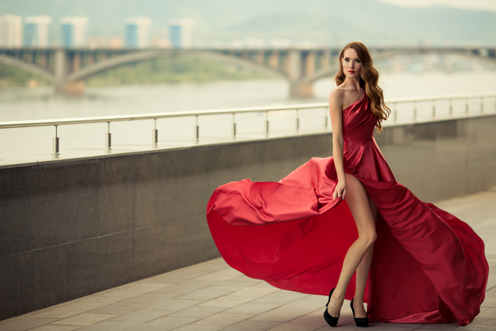 woman in red fluttering gown